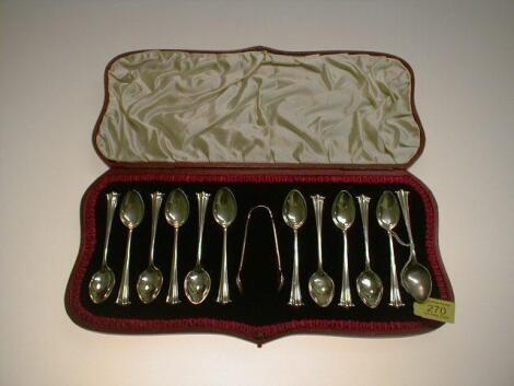 A set of twelve Victorian silver teaspoons and sugar tongs