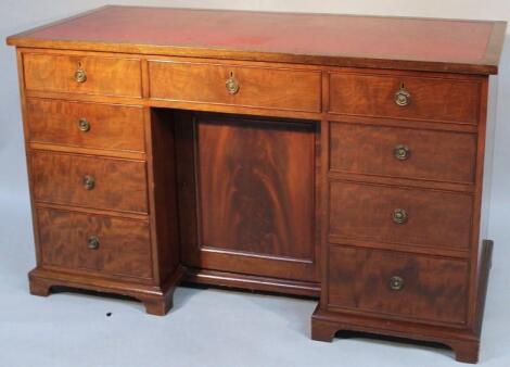 A late 19thC mahogany kneehole writing desk