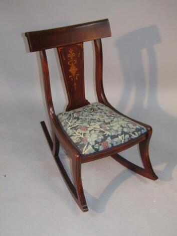 A Victorian mahogany bar back rocking chair