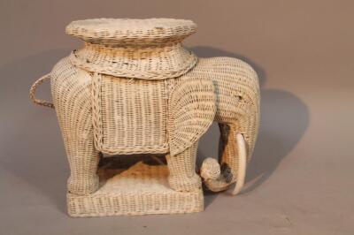 A 20thC Lloyd Loom style wicker work elephant