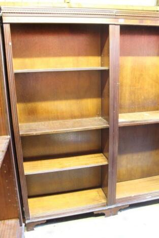 Three mahogany finish freestanding open bookcases