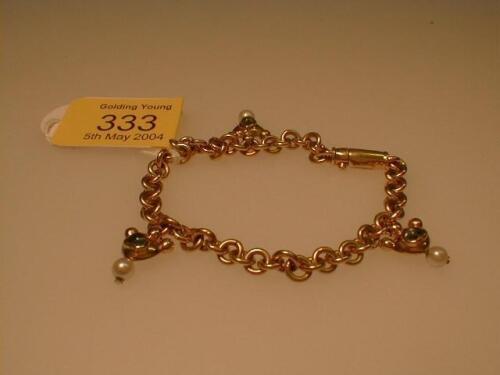 A heavy chain bracelet by Garrard & Co. with three stone set suspended