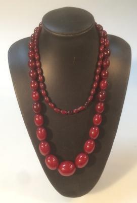 A string of graduated cherry amber beads