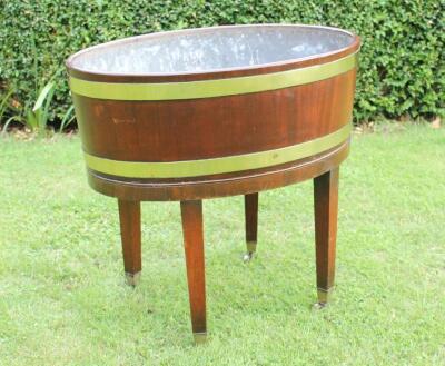 A George III oval mahogany wine cooler