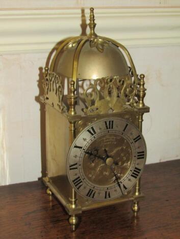 A reproduction brass lantern clock