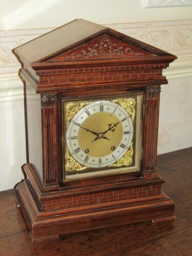 An Edwardian oak cased architectural bracket clock