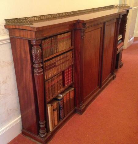 A William IV flamed mahogany breakfront cabinet bookcase