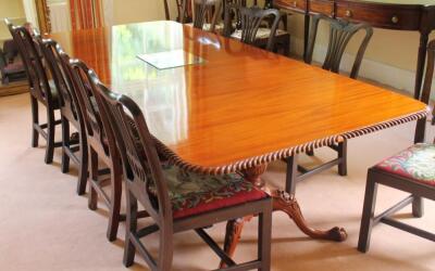 A reproduction Georgian mahogany twin pillar dining table