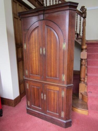 A George III oak standing corner cupboard