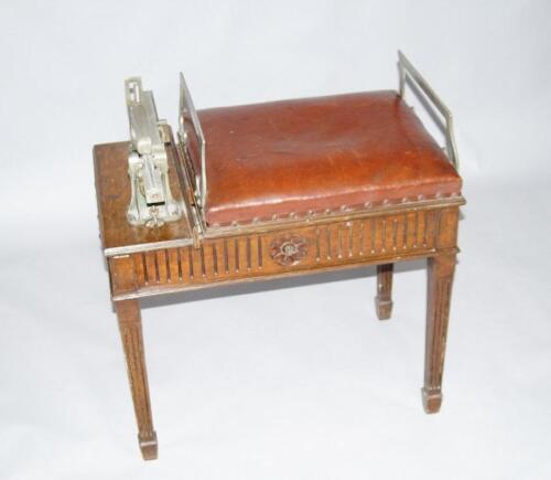 An Edwardian oak framed jockeys weighing seat by W and T Avery Limited