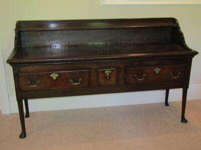 A mid 18thC oak dresser base