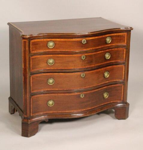 A George III mahogany serpentine fronted chest of drawers