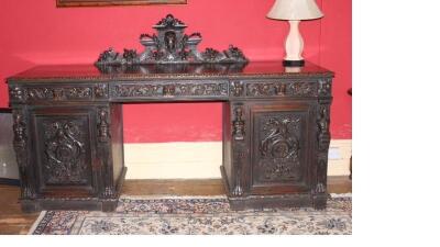 A 19thC Flemish style oak twin pedestal sideboard