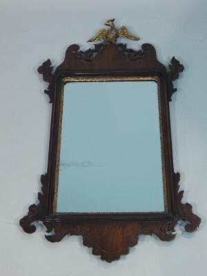 A George III mahogany fret framed wall mirror