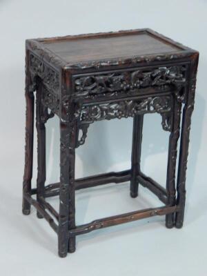 A nest of two early 20thC Chinese hardwood tables