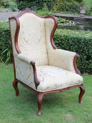 A 19thC mahogany wing armchair