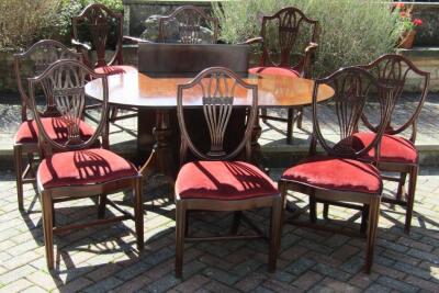 A set of eight Hepplewhite style dining chairs