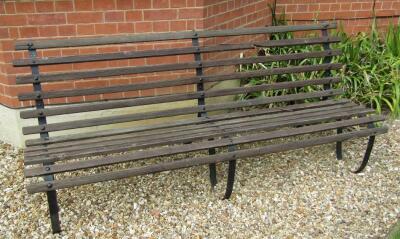 A Victorian style wrought iron garden bench