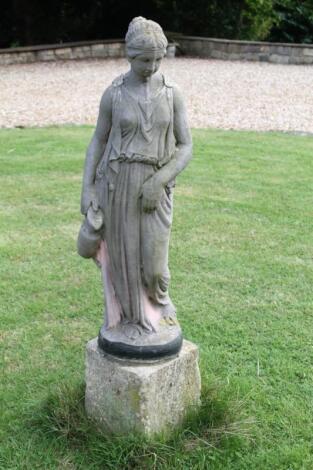 A modern garden figure of a Neo-Classical female water carrier