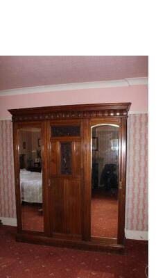 A late Victorian walnut wardrobe compactum