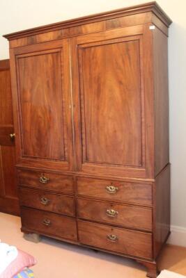 A 19thC flamed mahogany linen press