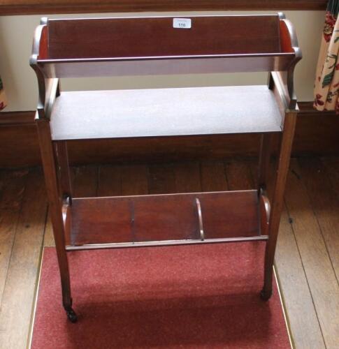 An Edwardian mahogany book trough