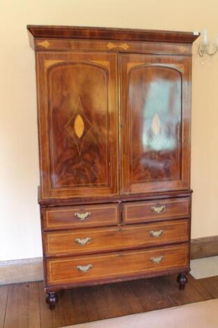 An early 19thC mahogany linen press