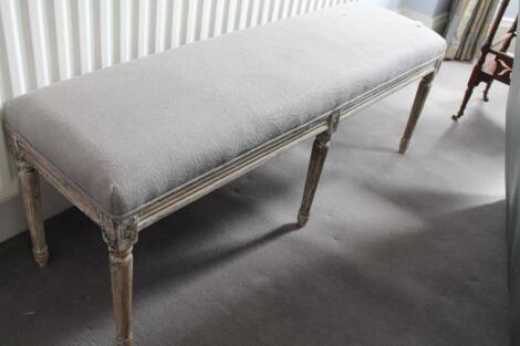 A reproduction Louis XVI limed and painted oak window seat