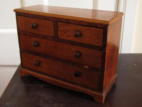 A Victorian oak miniature chest