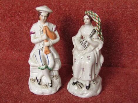 A pair of Victorian Staffordshire figures