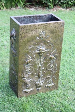 An early 20thC embossed brass stickstand.