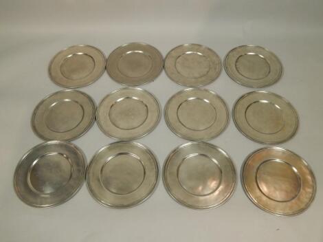 Twelve polished pewter plates