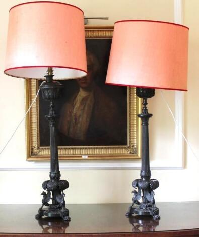 A pair of 20thC French bronze torcheres