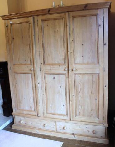 A pine triple wardrobe