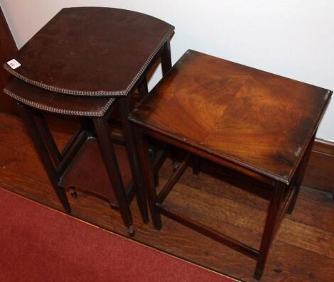 A nest of two beaded mahogany occasional tables