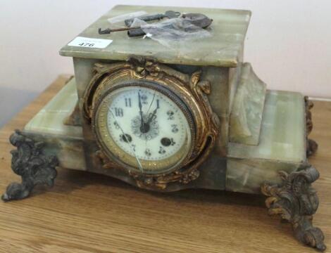 A Victorian gilt brass and onyx mantel clock