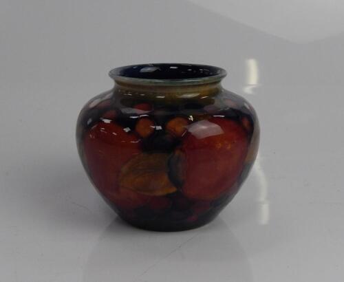 A Moorcroft pomegranate and grape vase