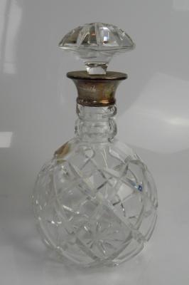 A modern cut glass silver mounted spirit decanter