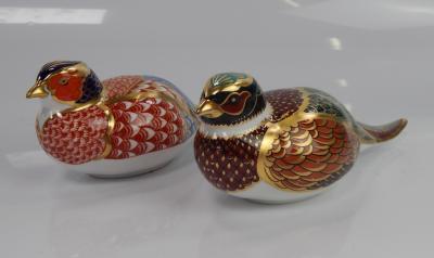 Two Royal Crown Derby pheasant paperweights.