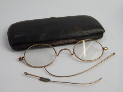 A cased set of spectacle frames.