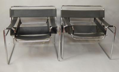 A pair of 1980's chrome and leather armchairs