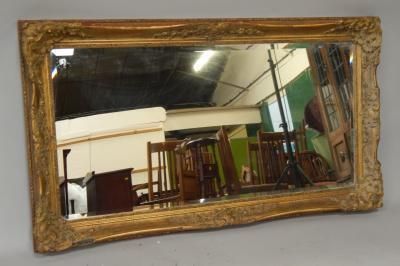 A large rectangular gilt framed bevel plate wall mirror.