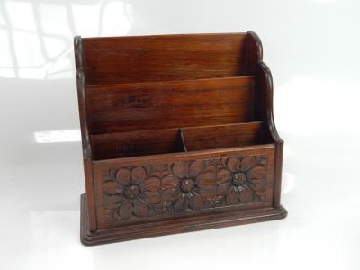 A carved hardwood four division stationery rack.