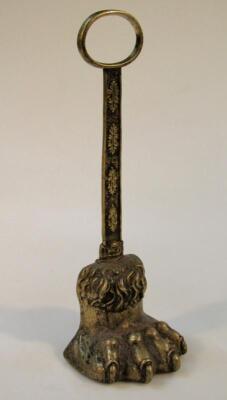 A mid-19thC brass lions paw door stop