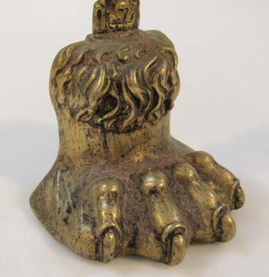 A mid-19thC brass lions paw door stop - 2