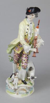 A late 19thC Continental porcelain figure of a bagpiper