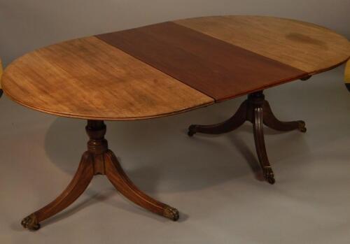 An early Regency style mahogany extending dining table