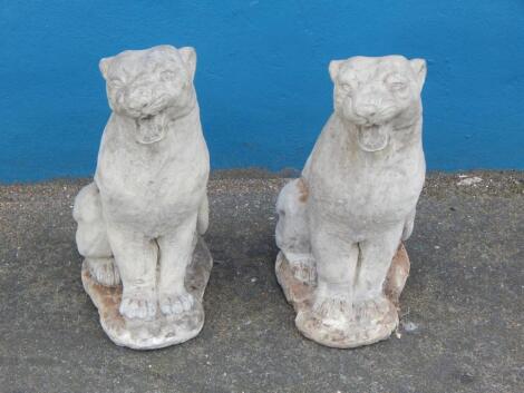 A pair of composition garden models of panthers