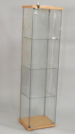 A glazed narrow display cabinet