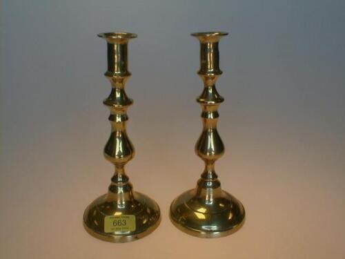 A pair of 19th century brass candlesticks